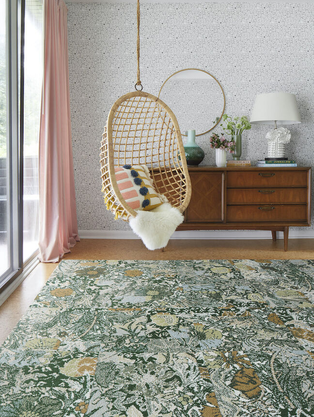 Bedroom nook with FLOR Among The Wildflowers area rug shown in Ivy